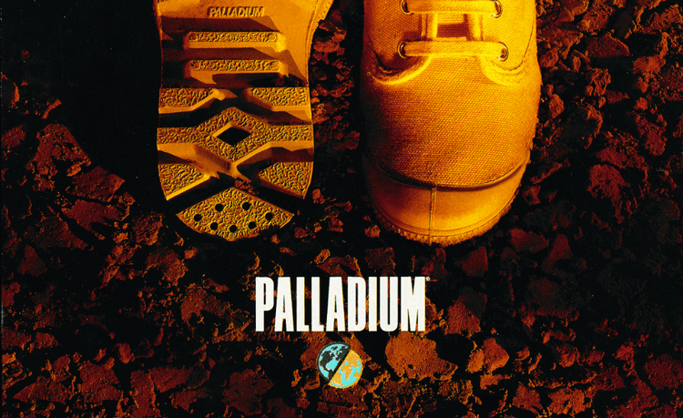 Overhead view of yellow Palladium shoe and sole print on rocky ground with PALLADIUM and Earth icon.