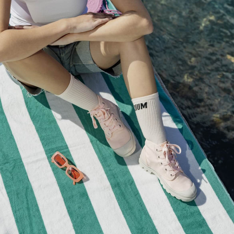 Woman wearing Pampa Hi boots on a dock near water