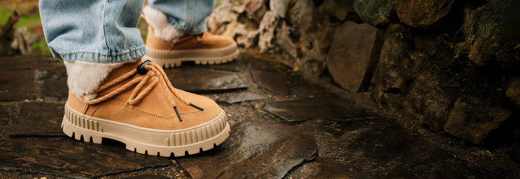 Pallashock Lo Hiver boots in Irish Brown on a stone walkway