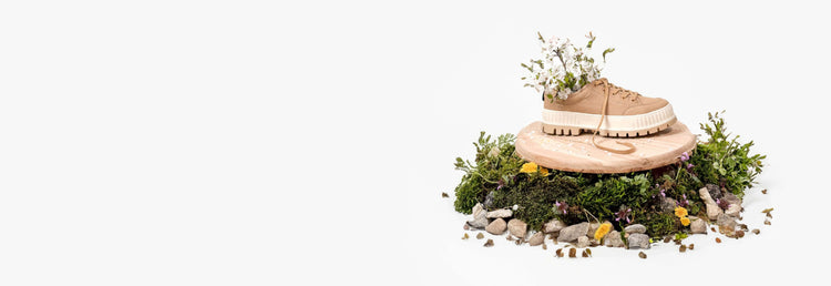 Image of Palladium Pallashock Lo Organic surrounded by plants and flowers