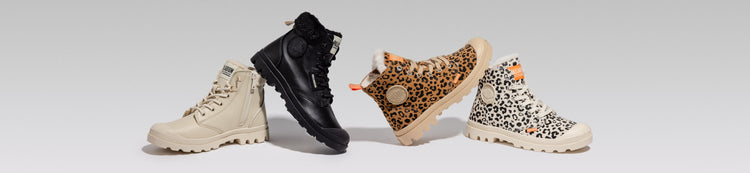 Four Palladium boots in different styles and colors on a gray background