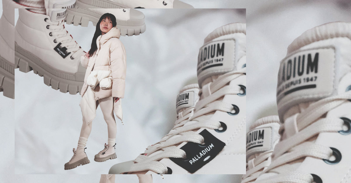 White Palladium boots with chunky soles, abstract background, and styled look.